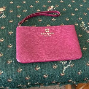 Kate Spade maroon 6 by 4 wristlet grained leather in pristine shape
